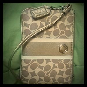 Small tan and white authentic Coach wristlet